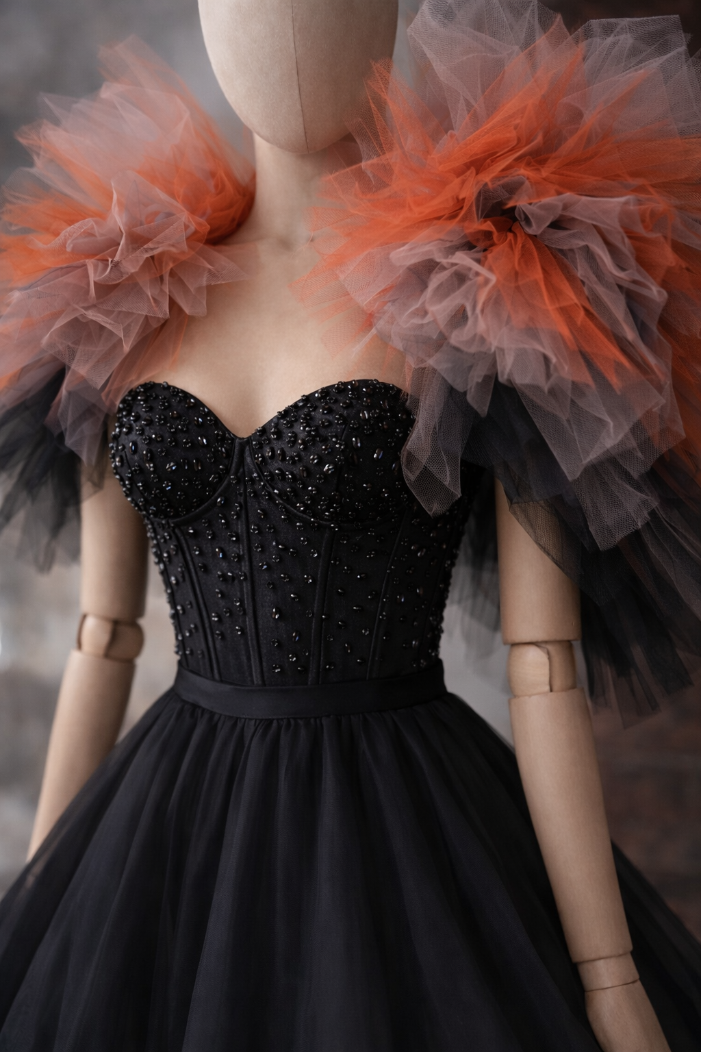 Detail of dramatic tulle collar shawl on avant garde black couture evening dress by designer Asya Kolarova