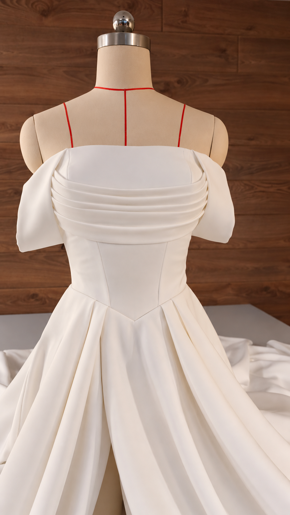 Side profile of full-skirt off-shoulder bridal gown
